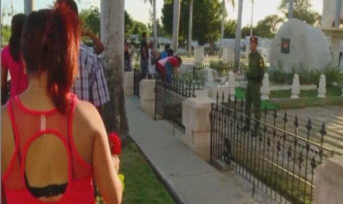 Visitors lay flowers at the tomb of late Cuban leader Fidel Castro